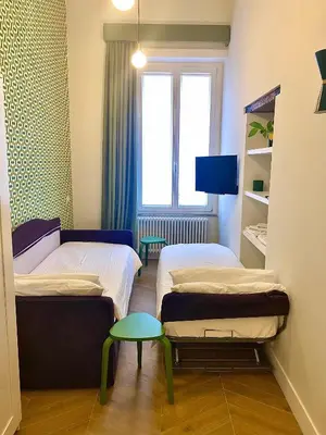 Letto o letti in una camera di Palazzo Massa Apartments