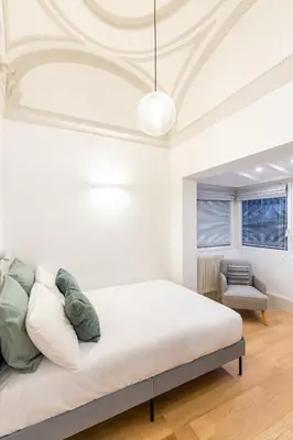Letto o letti in una camera di Cozy Studio in Chiaia district by Wonderful Italy