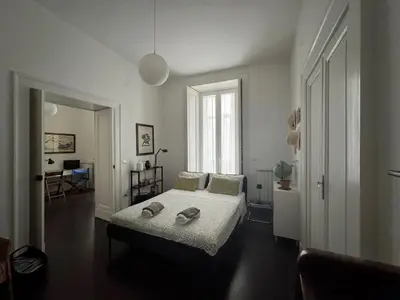 Letto o letti in una camera di Casa Vintage Napoli
