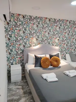 Letto o letti in una camera di Domus Leone