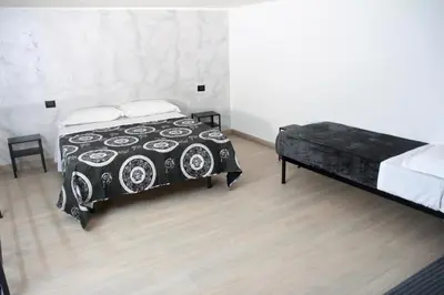 Letto o letti in una camera di LUXURY HOME VALENTINO