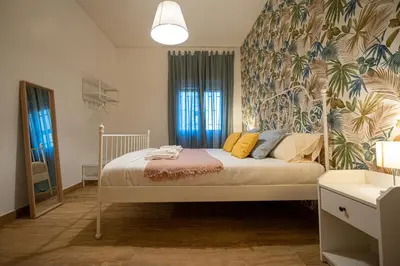 Letto o letti in una camera di Casa Partenope