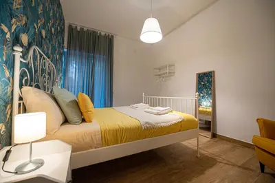Letto o letti in una camera di Casa Partenope