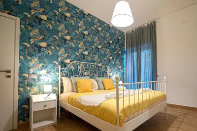 Letto o letti in una camera di Casa Partenope