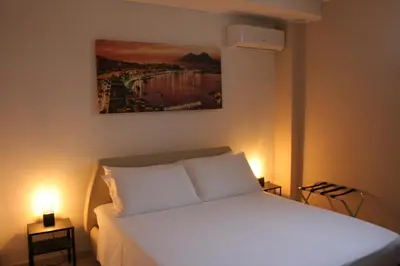 Letto o letti in una camera di Home Napulè