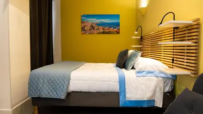 Letto o letti in una camera di Real Passeggio di Napoli