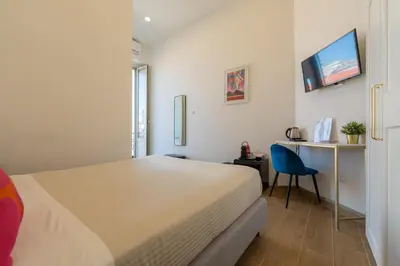 Letto o letti in una camera di Blu Parthenope Suites