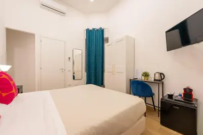Letto o letti in una camera di Blu Parthenope Suites