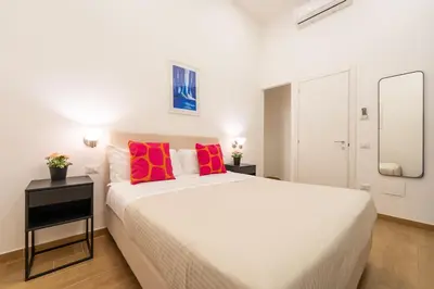 Letto o letti in una camera di Blu Parthenope Suites