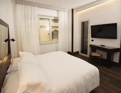Letto o letti in una camera di Domus Altana