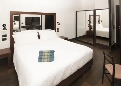 Letto o letti in una camera di Domus Altana