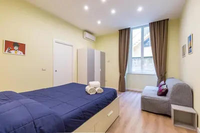 Letto o letti in una camera di San Marcellino Cool and Central by Napoliapartments