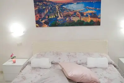 Letto o letti in una camera di Nonnona House-Napoli centro
