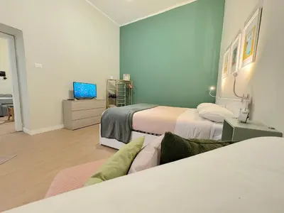 Letto o letti in una camera di DoHome Napoli