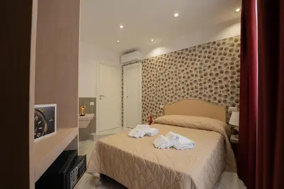 Letto o letti in una camera di P.C. Boutique H. LifeStyle, Napoli Centro, by ClaPa Group Dislocated Hospitality