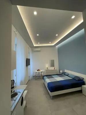 Letto o letti in una camera di DaDedo’ -Monolocale tra Plebiscito Toledo e Chiaia
