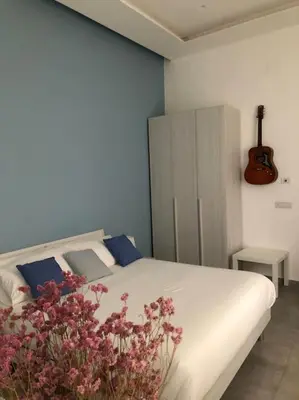 Letto o letti in una camera di DaDedo’ -Monolocale tra Plebiscito Toledo e Chiaia