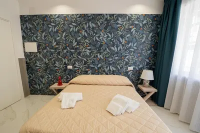 Letto o letti in una camera di GreRos H. Rooms Napoli Centro by Clapa Group Dislocated Hospitality