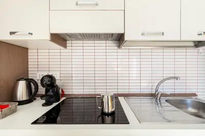 Cucina o angolo cottura di De Gasperi Apartment
