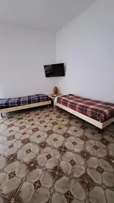 Letto o letti in una camera di Donnaromita holiday house hystoric center