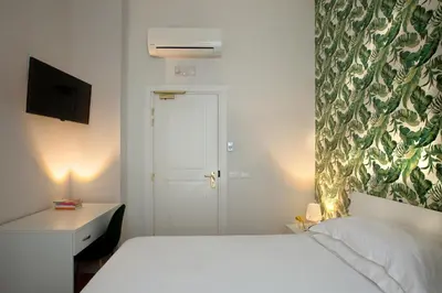 Letto o letti in una camera di Palazzo Sant'Antonio