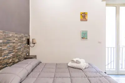 Letto o letti in una camera di Gelso Complex Studios and Flat by Napoliapartments