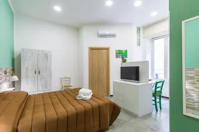 Letto o letti in una camera di Gelso Complex Studios and Flat by Napoliapartments