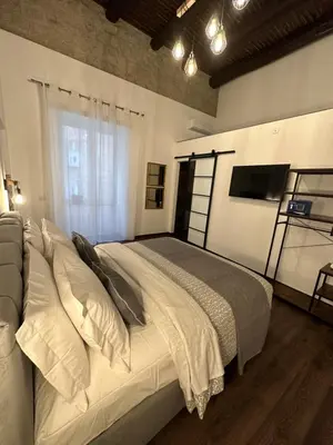 Letto o letti in una camera di LostNaples