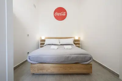 Letto o letti in una camera di AF Appart'Hotel Napoli