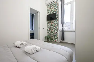 Letto o letti in una camera di AF Appart'Hotel Napoli