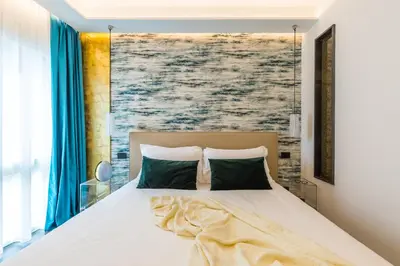 Letto o letti in una camera di Dei Martiri Suite
