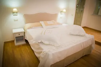 Letto o letti in una camera di I Racconti di Partenope