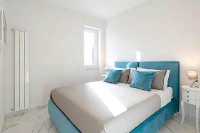 Letto o letti in una camera di Tema Suites - Dimore Partenopee
