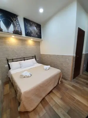 Letto o letti in una camera di Rosy Maison
