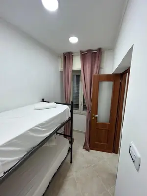 Letto o letti in una camera di DORA HOUSE VALENTINO