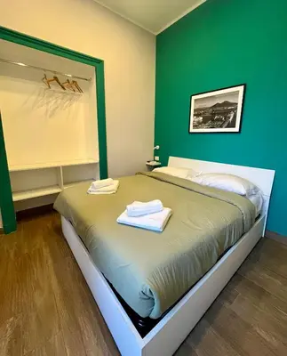 Letto o letti in una camera di A CASA DI PUPA GUEST HOUSE