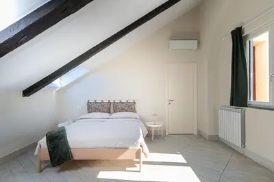 Letto o letti in una camera di Les Maisons Napoli
