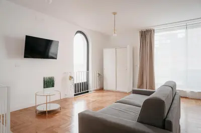 TV o dispositivi per l'intrattenimento presso Vista Napoli Residence by Casa Napoletana