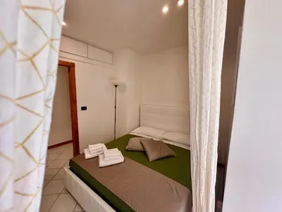Letto o letti in una camera di Mammina Home Chiatamone