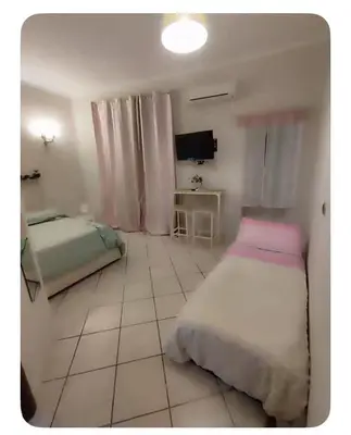 Letto o letti in una camera di Una terrazza al centro 2