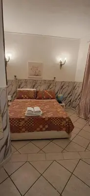 Letto o letti in una camera di Una terrazza al centro 2