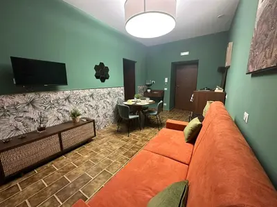 TV o dispositivi per l'intrattenimento presso Flowers House casa vacanze