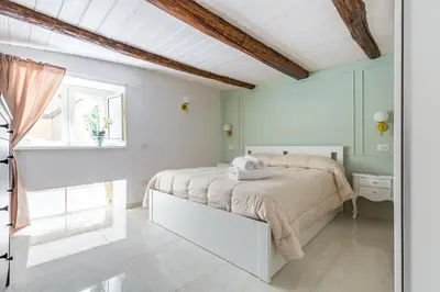 Letto o letti in una camera di Umberto's Nest at Toledo