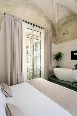 Letto o letti in una camera di Artemisia Domus - Giardino