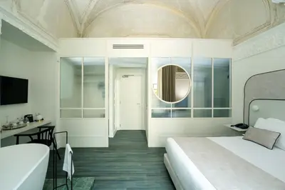 Letto o letti in una camera di Artemisia Domus - Giardino