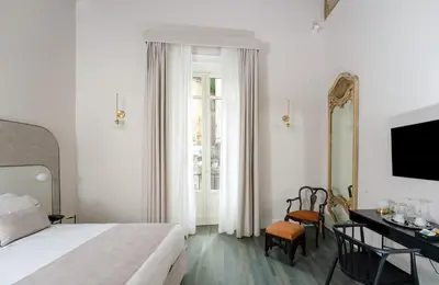 Letto o letti in una camera di Artemisia Domus - Giardino