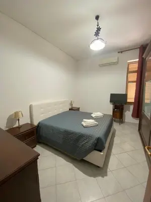 Letto o letti in una camera di Pulcinella's Nest vicino Centro Storico di Napoli