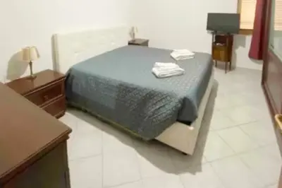 Letto o letti in una camera di Pulcinella's Nest vicino Centro Storico di Napoli