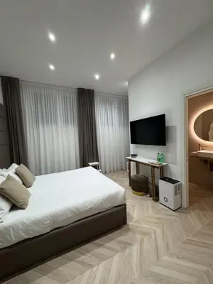 Letto o letti in una camera di NapoliOn - Luxury Apartment