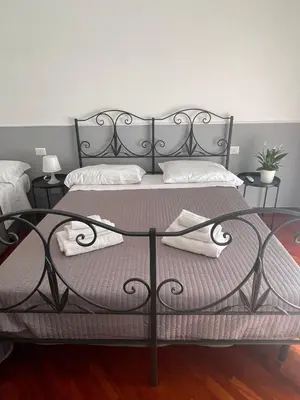 Letto o letti in una camera di Campanile Maison